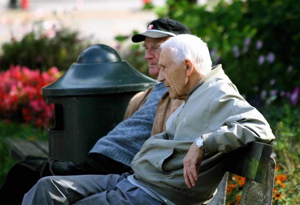 Two old men sitting on a bench