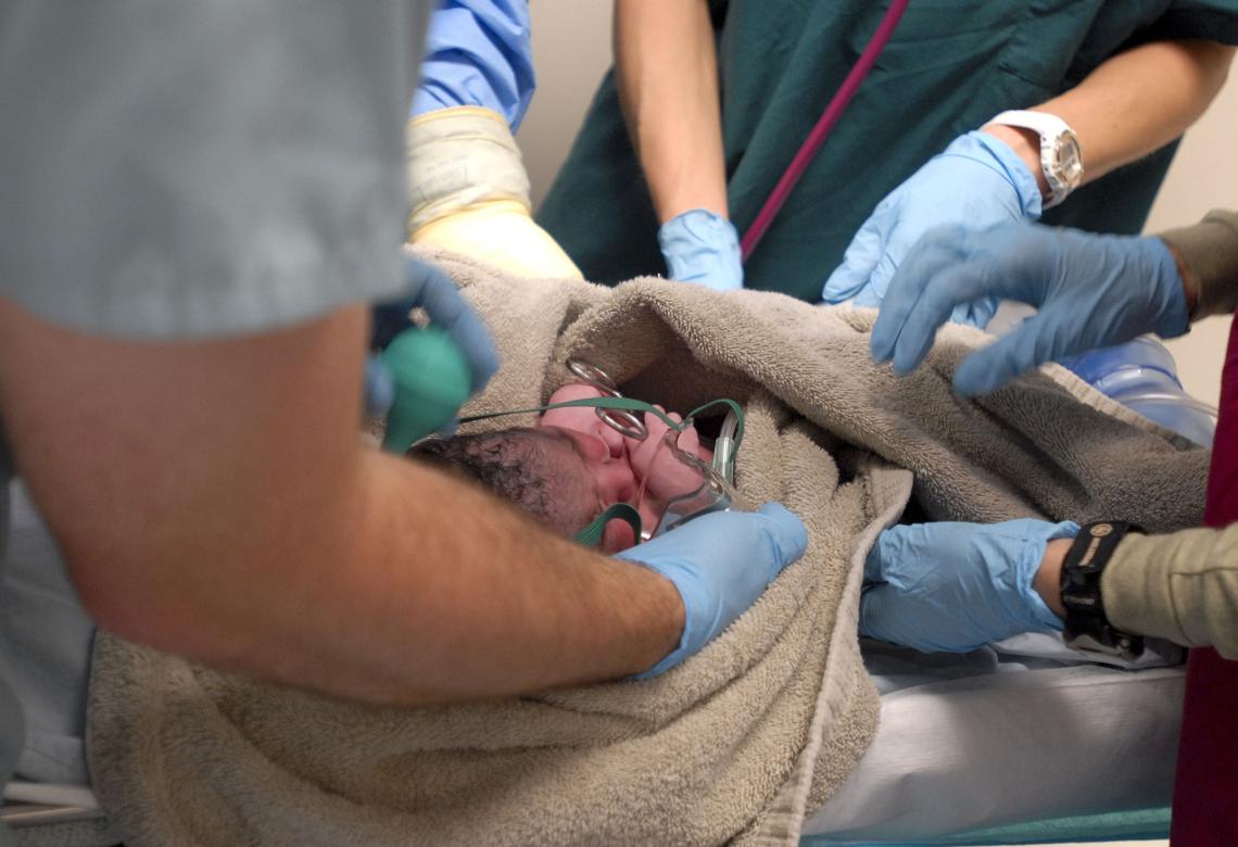 Afghan woman bears child at Coalition hospital, first child for mother, hospital